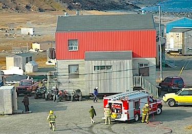 Volunteer firefighters in Kangiqsujuaq respond to a fire in a shed in 2009. The KRG is now recruiting Nunavimmiut for training that will see them become internationally-accredited firefighters. (PHOTO BY SARAH ROGERS)