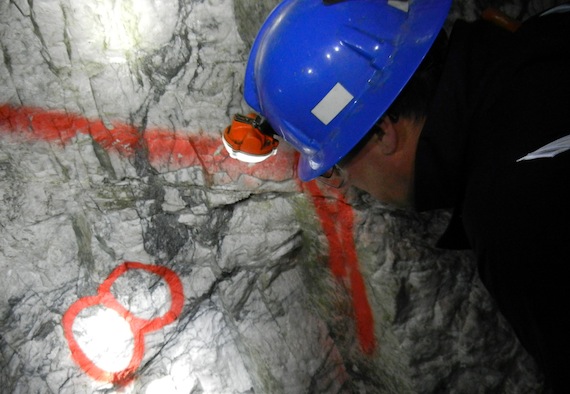 Peering at this white quartz vein on the wall of a mine shaft deep underground you can spot flecks of yellow gold. (PHOTO BY JANE GEORGE)