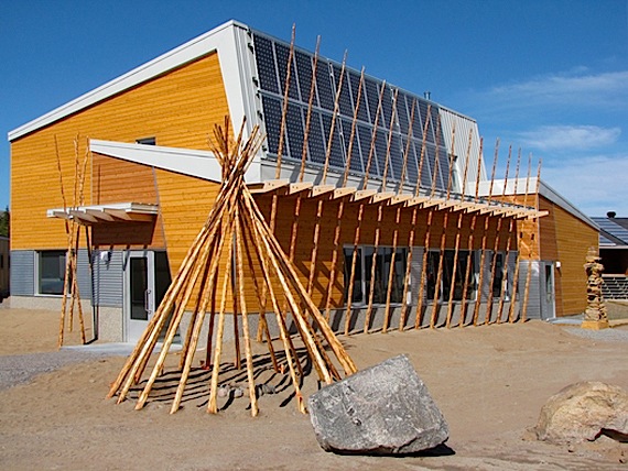 The poles lined up across the front of the new community science centre in the twin communities of Kuujjuaraapik and Whapmagoostui reflect those of a deconstructed tipi. These poles are actually pipes called thermosiphons, which keep the ground frozen under the building and evacuate heat. (PHOTO COURTESY OF FGMDA)