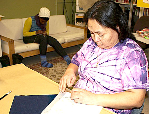 Susan Enuaraq embroiders an image she created as part of the Healing Through Art gathering held Nov. 26 in the Nunavut Arctic College fine arts building in Iqaluit. A similar session, scheduled for Dec. 3, from 2 p.m. to 6 p.m., is open to anyone who wishes to commemorate the loss of a loved one through art. The art created will be displayed as part of the annual National Day of Action and Remembrance on Violence Against Women ceremony Dec. 6 at Inuksuk High School. (PHOTO BY DEAN MORRISON)