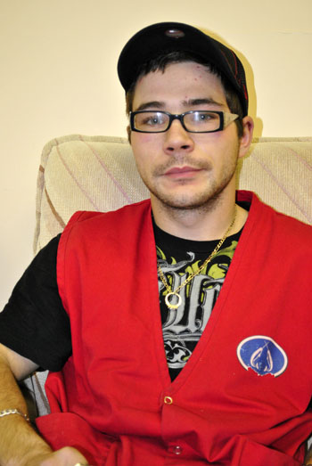 Arthur Wilson knows he's a lucky man, after a bullet fired into his staff house unit grazed his head as he slept. To cope with the shock, he's gone back to work. (PHOTO BY JIM BELL)