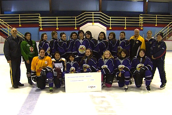 Hockey in Iqaluit received a boost Nov. 5, when the RCMP Foundation presented a $2,500 cheque to the Iqaluit Amateur Hockey Association for its girls hockey program. Cpl. Yvonne Niego of the Iqaluit RCMP detachment had asked for some help to develop the girls hockey program in co-operation with IAHA and other partners, a Nov. 8 RCMP news release says. Here Sgt. Kim Melenchuk of the Iqaluit RCMP detachment, to the left, stands with the hockey program's players and coaches, who are displaying a giant-sized image of the cheque. (PHOTO COURTESY OF APTN)