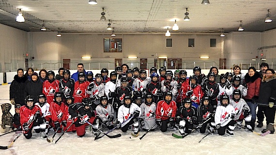 Nearly 100 players from Tasiujaq and Aupaluk, aged 6-18, participated in Hockey Canada’s skills camp held in Tasiujaq Nov. 19 and 20. Here, both communities’ Atom and Peewee players pose with their parents and coaches. (PHOTO COURTESY OF THE NYHDP)