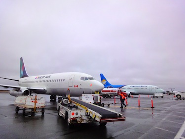 First Air and Canadian North, seen here at Rankin Inlet's airport, have added fuel surcharges and plan for an increase in cargo rates, following the GN decision to increase the price of aviation fuel in Nunavut on Nov. 1.  (PHOTO BY JANE GEORGE)