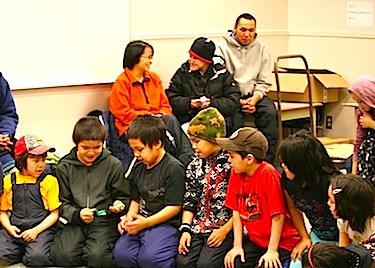 Kids play games at Ilisaqsivik's Dec. 15 Christmas Party in Clyde River. (PHOTO BY JORDAN NATANINE, COURTESY OF ILISAQSIVIK)