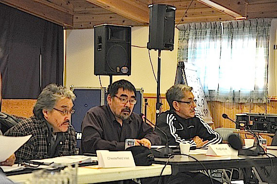 Whale Cove Mayor Percy Kabloona, centre, was selected as interim president and chair of a special meeting of the Nunavut Association of Municipalities in Iqaluit Dec. 6. The organization must fill the president's position following the abrupt resignation of its former president Sakiasie Sowdlooapik Dec. 3. The meeting in the Anglican parish hall continues Dec. 7. (PHOTO BY SARAH ROGERS)