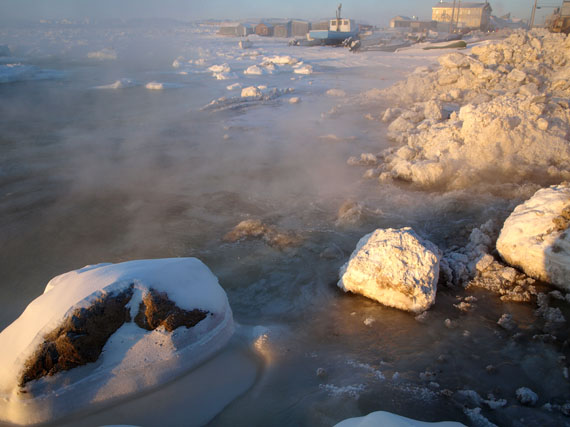 At about 11:00 a.m. Jan. 13, water continued to drain into Frobisher Bay near Iqaluit's breakwater. A burst pipe at Inuksuk High School sent more 20 million litres of water cascading into the bay just after midnight Jan. 13, flooding low-lying areas near the beach. Snowmobilers are advised to say away from the breakwater area because of unsafe ice conditions. As of 11:45 a.m., the situation had been brought under control and levels at Iqaluit's reservoir continue to rise. Mayor Madeleine Redfern said trucked water service will