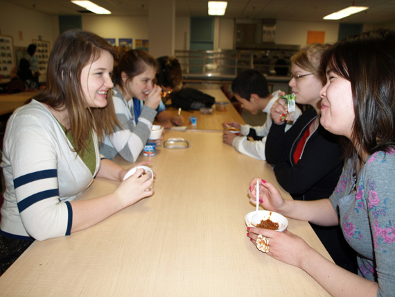 Margo Crawford, Eelai Uniuqsaraq and Kira Bychok are eating reduced versions of their normal lunches as part of a four-day hunger awareness project for their social studies class. From Jan.10 to Jan. 14, participants will cut back on what they normally eat by one-third.  (PHOTO BY DEAN MORRISON)
