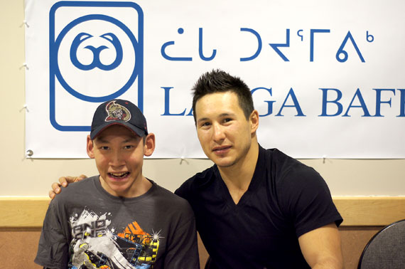 Nashville Predators rightwinger and Rankin Inlet native Jordin Tootoo, right, stopped in to see residents at Larga Baffin in Ottawa Feb. 8. Here, Tootoo stopped to chat with Aaron Manik of Resolute Bay before serving up cake to patients at the Ottawa residence. A few lucky patients will get to see Tootoo in action tonight when Large Baffin hands out 26 tickets to see the Ottawa Senators host the Nashville Predators Feb. 9. (PHOTO BY TRUDY METCALFE)

