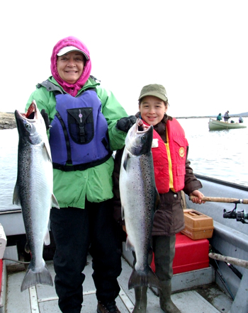 Mary Simon with her neice Amber May in 2011, after catching two twenty-pound salmon in the Koksoak river outside of Kuujjuaq. Simon has donated a fishing trip guided by her and her family members to the Arctic Children and Youth Foundation, which will be auctioned off Feb. 4 to raise money for the organization. (PHOTO COURTESY OF BOBBY MAY)