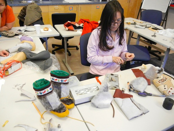 Korinna Harvey of Cambridge Bay works on a pair of sealskin kamiks during a Nunavut Arctic College sealskin sewing workshop held Feb. 13 to 17 in Cambridge Bay. Read about the workshop on nunatsiaqonline.ca. (PHOTO BY JANE GEORGE)