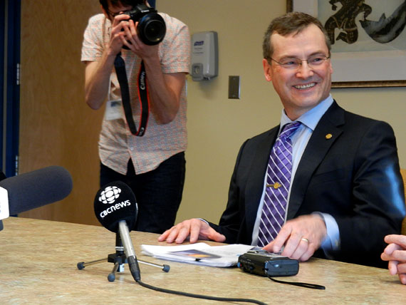 Finance Minister Keith Peterson shares a joke with his officials at the end of a budget lockup held Feb. 22 at the Nunavut legislature in Iqaluit, just before he tabled what he called a