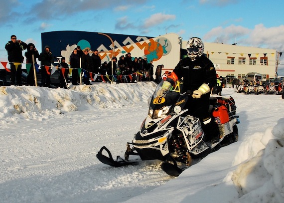 Kuujjuamiut wave off snowmobilers in the Cain's Quest Snowmobile Endurance Race March 21. Twelve teams had checked in to Kuujjuaq March 20 for a 16-hour layover in the race called
