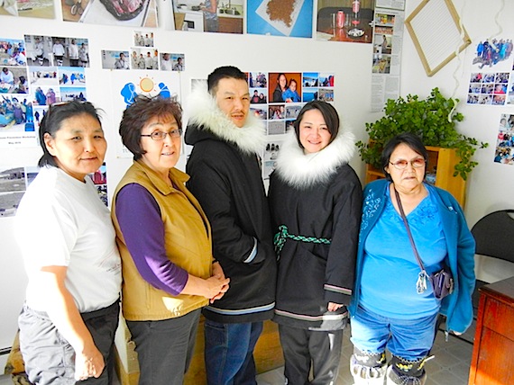 One month after the Feb. 26 fire at Iqaluit's Creekside Village burned all their possessions, Nunavut Arctic College environmental technology students, Andrew Arreak of Pond Inlet and Dorothy Quqshuun of Gjoa Haven (centre), wear the new parkas made for them by Eva Naloolak, Elisapi Aningmiuq and Oleepeek Nooshoota of the Tukisigiarvik Centre in Iqaluit. Read more about how these two students are managing on Nunatsiaqonline.ca (PHOTO BY JANE GEORGE)