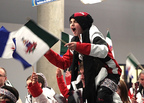 This host team member from Yukon shows a lot of enthusiasm as the teams parade into the March 4 opening ceremonies at the Canada Winter Games Centre in Whitehorse, an event which Included dancing and anthems and the screening of official theme song video. The games' competitions start March 5 and end March 10. (PHOTO COURTESY OF MAKIVIK MAGAZINE)