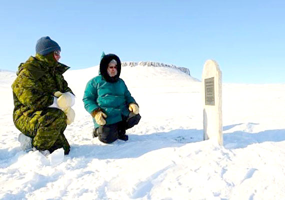 Commander Joint Task Force (North), Brigadier-General Guy Hamel, and Qikiqtani Inuit Association vice-president, George Eckalook, take a moment to read the grave marker of a sailor that perished in the mid-1800s on Beechy Island. Four markers from the doomed Franklin Expedition dot the island, visited during Operation Nunalivut 2012, one of the Canadian Forces' Arctic sovereignty operations. (PHOTO BY SGT. MATTHEW MCGREGOR, CANADIAN FORCES COMBAT CAMERA)