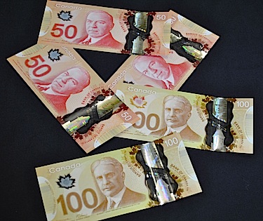 The Bank of Canada is introducing new plastic bank notes like these $50 and $100 bills which are supposed to evoke 