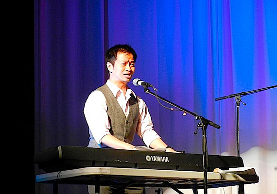 Anthony Fong, a recent arrival to Iqaluit from Vancouver, performs a Chinese song with the Iqaluit-based trio, Koel & the Twin Otters, at the April 12 opening of Toonik Tyme. This year's theme for the annual spring festival: diversity. The opening ceremonies also included Inuit throatsinging, modern drum dancing, an Indian love song and reggae-inspired tunes. (PHOTO BY JANE GEORGE)
