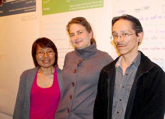 The City of Iqaluit aspires to a new sustainable future. Here, interpreter-translator Leah Inutiq, sustainability co-ordinator Robyn Campbell and interpreter-translator Andrew Dialla pose at the Nunatta Sunakkutaangit Museum in front of a poster covered with suggestions for Iqaluit's future — such as world youth volunteer groups, recycling programs to reduce waste, an addictions treatment centre, and improved access to post-secondary education, just to name a few. The poster is part of Iqaluit’s sustainable Iqaluit interactive community exhibit, which includes old photos, locally-produced videos and games. If you didn't see the exhibit at the museum, you can see it May 24, from 11 a.m. to 4 p.m., at the Nanook School in Apex. (PHOTO BY SAMANTHA DAWSON)
