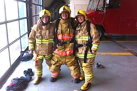 A student from Ivujivik poses with firefighters from Lévis during his recent exchange trip to the community. (PHOTO COURTESY OF THE JOURNAL DE LEVIS)