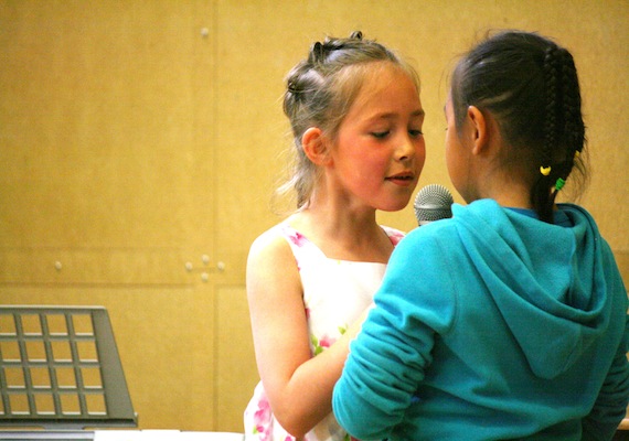 Joamie Elementary School students Akutaq (left) and Aniita (right) throat sing at their school's June 19 talent show in Iqaluit. Other acts at the show included break dancing, magic tricks, hoola-hooping, gymnastics and more. June 21 is the last day before summer break kicks in for kids. (PHOTO BY DAVID MURPHY)