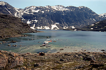 Helicopters, like this one at Ogac Lake on south Baffin Island, are often used by scientists and mineral exploration firms during the summer. At their June 12 meeting, Iqaluit city councillors complained they make too much noise. (FILE PHOTO)