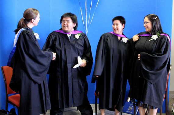 Nunavut Arctic College graduates Sarah MacRury (left), who received a B.Sc in nursing from Dalhousie University, with Dwayne Haqpi, Jolene Itkilik and Emily Joanasie, who earned B.Ed degrees from the Nunavut Teacher Education Program, celebrate their achievements June 7 at a ceremony held at the Frobisher Inn attended by about 50 people. Itkilik received the best practicum award and Haqpi gave the student address. (PHOTO BY SAMANTHA DAWSON)