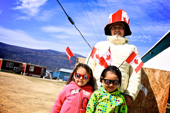 Alicia (in pink), Madison (in green) and Alice Kuluguqtuq of Pangnirtung were all dressed up and ready to celebrate Canada Day in their home town this July 1. (PHOTO BY SARAH MCMAHON)