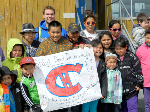 Habs forever: The Montreal Canadiens star centre, David Desharnais, visited Kangirsuk recently on a fishing trip. Here, he's posing July 11 with children from the Kangirsuk day camp. (PHOTO BY VICTORIA SIMIGAQ)