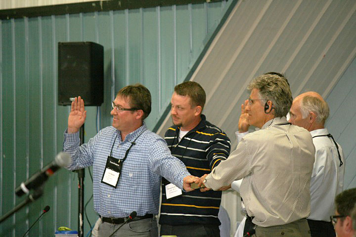 Representatives from the Baffinland Iron Mines Corp. are sworn in on the morning of July 16, the first day of final hearings on the Mary River project that the Nunavut Impact Review Board will conduct all week at the Iqaluit cadet hall. (PHOTO BY SAMANTHA DAWSON)