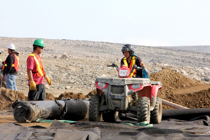 Workers at the Cape Dyer site working on the landfill at the upper site, the busiest place at Cape Dyer when it was operating. (PHOTO BY SAMANTHA DAWSON)