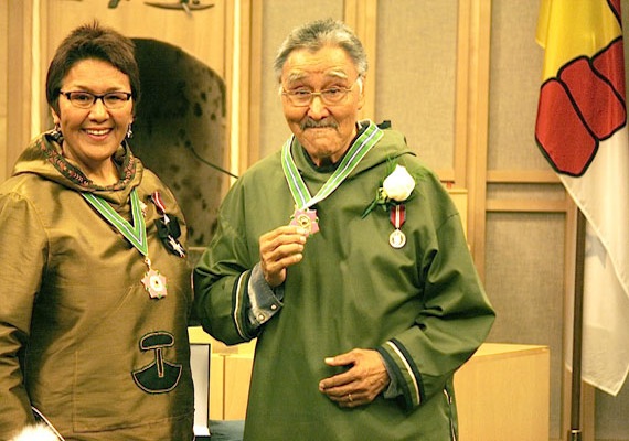 Commissioner of Nunavut Edna Elias with famed Inuk musician Charlie Panigoniak, 67, at his Order of Nunavut ceremony at the Nunavut Legislative Assembly Sept. 20. “A while back I had a desire to sing on the land, in school, on local radio. With this desire, I composed songs to lift the spirits of the people,” said Panigoniak to an audience of more than 80 people. (PHOTO BY DAVID MURPHY)