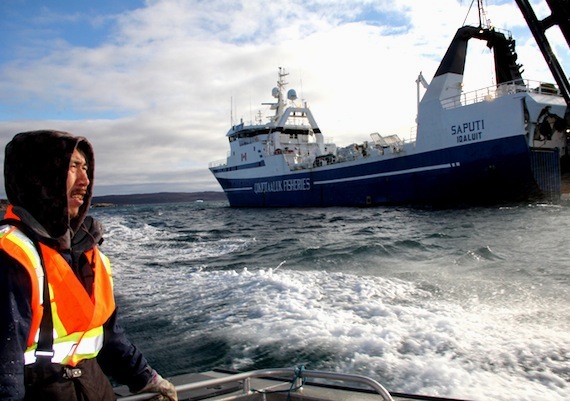 A Qikiqtaaluk Corp. employee helps usher people to the ship Saputi Oct. 5 for a public tour, although not many attended the event. To learn more about the Saputi, read a special feature story about the ship on Nunatsiaqonline.ca. (PHOTOS BY SAMANTHA DAWSON)