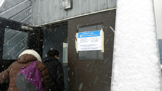 A blustery autumn snow squall that brought winds of 40 to 60 km/h and about 5 cm of snow didn't keep Iqaluit voters away from the polls Oct. 15. Iqaluit residents will elect a mayor, eight city councillors and five members for the Iqaluit District Education Authority. Ratepayers only will vote in a referendum to authorize borrowing of up to $40 million for a new aquatic centre. Just after 2:00 p.m., more than 400 people had already voted at the Iqaluit cadet hall, one of two polling places. Polling closes at 7:00 p.m. Iqaluit's returning officer, Kirt Ejesiak, said that as soon results are available, they will be posted on the Iqaluit elections website: www.iqaluitelections.ca. (PHOTO BY JIM BELL)