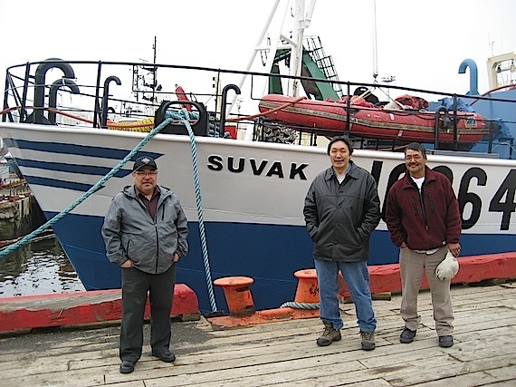 Members of the Arctic Fishery Alliance stand with chairman Lootie Toomasie (far left) in front of their 100-foot factory freezer fixed gear vessel, the Suvak. (HANDOUT PHOTO)
