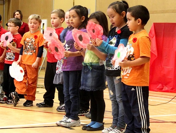 Students at Iqaluit's Joamie School sing and read poems to mark Remembrance Day in a ceremony held Nov. 9 in the school gym, where they were joined by family members and school staff. Students pinned poppies onto a cross and observed a moment of silence. Remembrance Day is observed Nov. 11 to remember the sacrifices of those who died in war, and recall the end of hostilities of World War I on that date in 1918. Hostilities formally ended