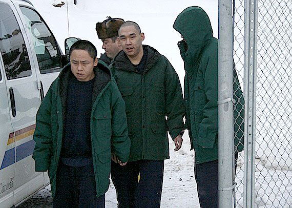 Herbert Janes, Willie Ishulutak and Sylvester Tarraq are escorted to an RCMP vehicle after appearing Nov. 23 at the Nunavut Court of Justice in Iqaluit. The three are charged with aggravated assault and arson endangering lives in connection with the Nov. 12 fires at Baffin Correctional Centre. Four others, Arnaitok Nuvaqiq, Geteonie Kopalie, Anawalkooloo Michael and William Auksaq are accused of aggravated assault from incidents alleged to have occurred that night. (PHOTO BY DAVID MURPHY) 