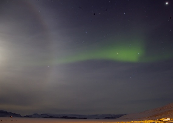 Northern lights dance with a moon and ring to the tune of a dog team's howls, all under the watchful eye of Jupiter (upper right) in the early morning hours of Dec. 4 in Arctic Bay. (PHOTO BY CLARE KINES)
