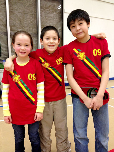 Kadin Copland, William Campbell and Isiah Curley wearing their “Soccer for Hope” tee shirts. (PHOTO COURTESY M. CRANDALL)