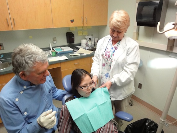 People in Nunavut's larger communities like Cambridge Bay, shown here, see dentists like Malcolm Crozier, with hygienist Ethel Bailey (shown here in 2010) regularly — for 12 days a month. (FILE PHOTO)