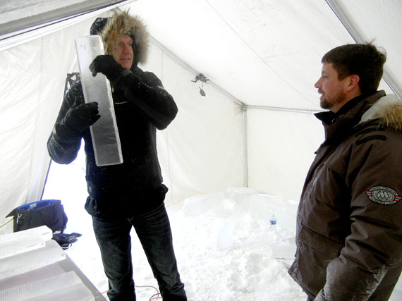 Norwegian jazz musician Terje Isungset, who makes music on instruments made from ice, at left, listens to the tone of a piece of ice prepared by Bill Covitz, his ice instrument maker, in tent set up outside Inuksuk High School in Iqaluit. Isungset will perform a concert at 7:30 p.m. on Feb. 19, , part of the Alianait arts festival concert series. The instruments for the Iqaluit concert, which marks Isunget's most northerly concert venue in North America, came from ice harvested from a lake nearby Iqaluit, carved with a chain saw and picks and smoothed with a blow torch. Read more about Isungset's ice music on Nunatsiaqonline.ca. (PHOTO BY JANE GEORGE)