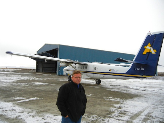 René Laserich, operations manager at Adlair Aviation Ltd., the Cambridge Bay airline his bush pilot father started, stands in October, 2012 in front of one of the company's two hangars at the Cambridge Bay airport. (FILE PHOTO)