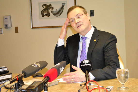 Keith Peterson, the Nunavut finance minister, wipes some perspiration from his brow Feb. 27 while he prepares to make remarks to reporters gathered at a budget lockup just prior to his 2013 budget address at the legislative assembly. Peterson said the Government of Nunavut expects to produce a small surplus of $21.9 million by March 31, 2014. And in 2013-14, the GN expects to spend about $1.65 billion — about $43,465 for every man, woman and child in the territory. Read more on Nunatsiaqonline.ca. (PHOTO BY JIM BELL)