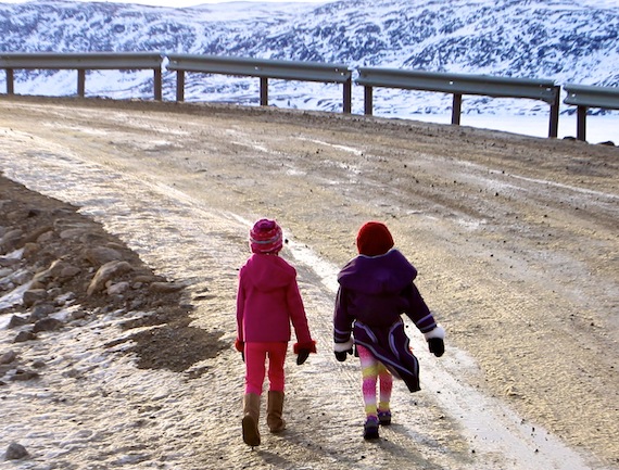 These girls, like many in Pangnirtung, get outside to enjoy the record-breaking temperatures of March 18 and 19. (PHOTO BY SARAH MCMAHON)
