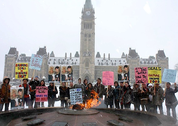 Nunavut Sivuniksavut students carry placards at a March 15 rally, held on Parliament Hill in Ottawa, to promote Inuit seal harvesting. The students at the Ottawa-based college program for Nunavut Inuit also put on a sealskin fashion show, modelling sealskin outfits provided by Nunavut's environment department. The event was a dress rehearsal for their March 16 trip to Toronto, where animal rights groups were expected to hold — but then cancelled —demonstrations to protest the harvesting of seals and other animals. The NS students still plan to hold their own parallel rally on March 16 to educate people in Toronto about the continued importance of seal harvesting for the Inuit culture and economy. (PHOTO COURTESY OF NS)