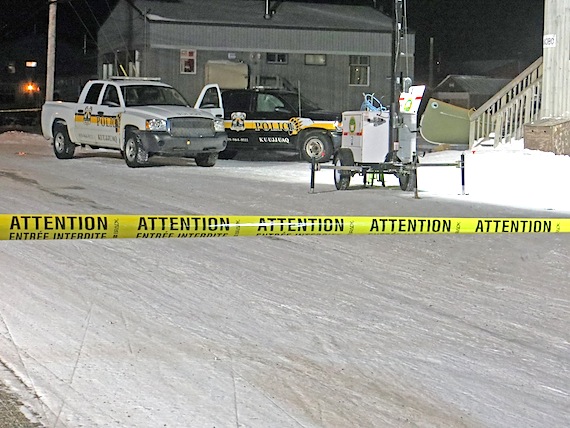 During the evening of March 3, trucks belonging to the Kativik Regional Police Force remain parked behind the large perimeter set up by volunteer firefighters around House 1080 on Chopper Crescent in Kuujjuaq, where a violent confrontation between an armed man and police unfolded over the evening of March 2 until about 3 p.m. on March 3. (SUBMITTED PHOTO)