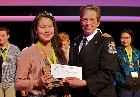 Anne Sequaluk, 15, of Kuujjuaq, smiles with Kativik Regional Police Force chief Aileen Mackinnon after learning that her project which looked at the bacteria found in dogs and people won second prize at the Quebec Aboriginal Science Fair for Secondary Two and Three students. Sequaluk also won the Pan-Canadian prize, which means she will present her project in May at a national science fair in Alberta. See more photos and read about the event later on Nunatsiaqonline.ca. (PHOTO BY PASCAL POULIN)