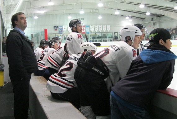 Rankin Inlet coach Hamish Tatty and his team anxiously eye the play against Iqaluit on April 13, in game two of the Eastern Arctic division's best-of-three final in the Northern Hockey Challenge. Rankin beat Iqaluit 7-4, tying the series at one game apiece. The teams play the third and deciding game of the weekend series at Iqaluit's Arctic Winter Games Arena on April 14 at 6 p.m. (PHOTO BY PETER VARGA)
