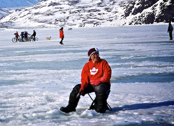 People in Pangnirtung fish and frolic out on the ice April 8 during the community's hamlet day celebrations. (PHOTO BY SARAH MCMAHON)