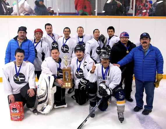 Members of Pond Inlet senior men’s hockey team pose on the ice April 14, shortly after winning the annual Pond Inlet senior men’s hockey tournament. Pond Inlet beat Clyde River’s team 11-4 in the final game during tournament held in Pond Inlet. In the back Row (from left to right) — Joe Enook, Tununiq MLA, Mosa Qanguq, Kain Killiktee, David Suqslak, Ian Schneider, Jay-Simon Nashook, Joanasie Tigullaraq, Simon Merkosak (coach), Sula Atagootak (hidden), and Joshua Arreak, deputy mayor; in the front row (from left to right) — Jimmy Pitseolak, Chris Merkosak, Bryan Simonee and Jollie Enoogoo. (PHOTO BY GRIGOR HOPE)